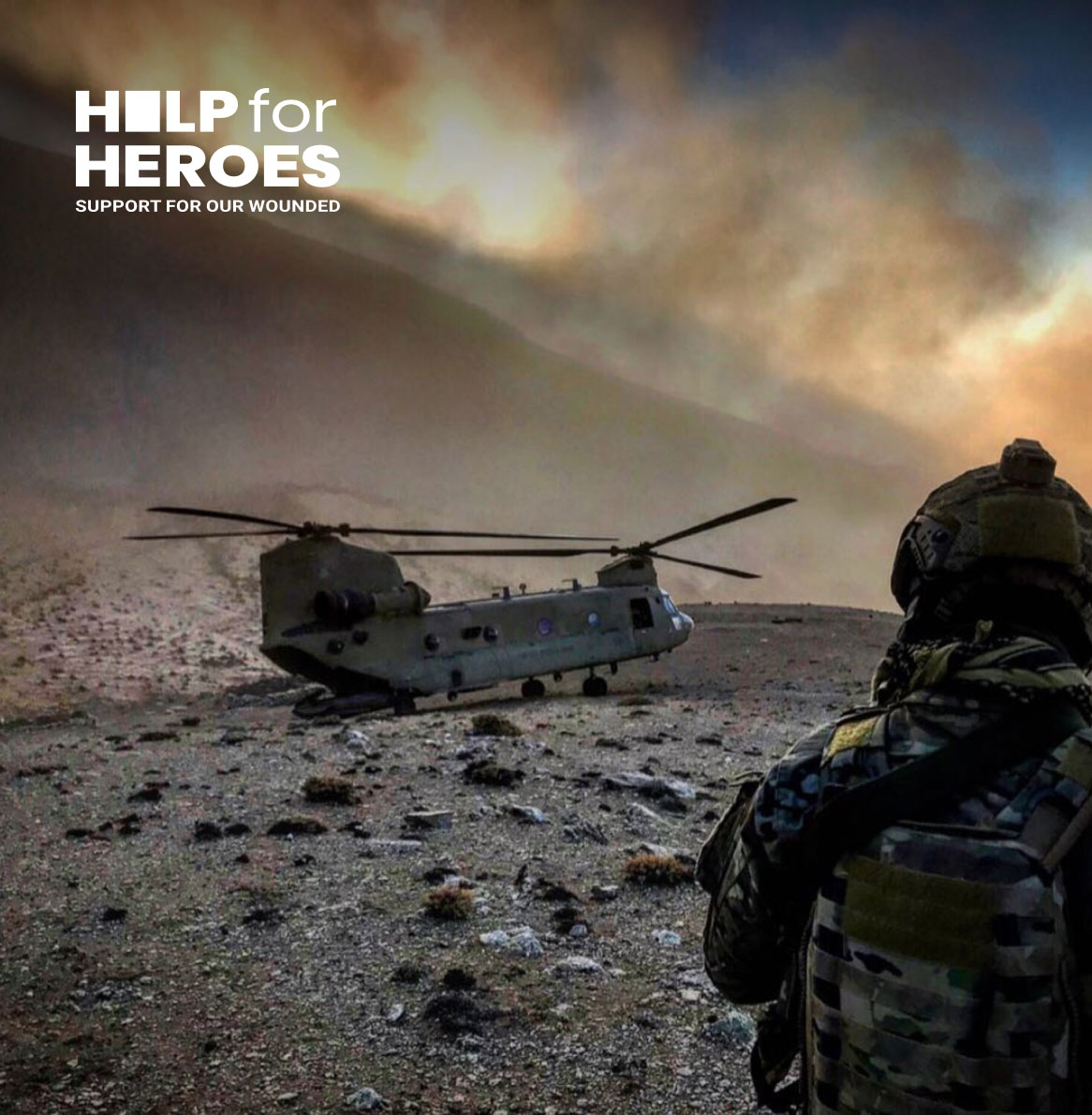Man pulling back an archery bow to face | Help for Heroes