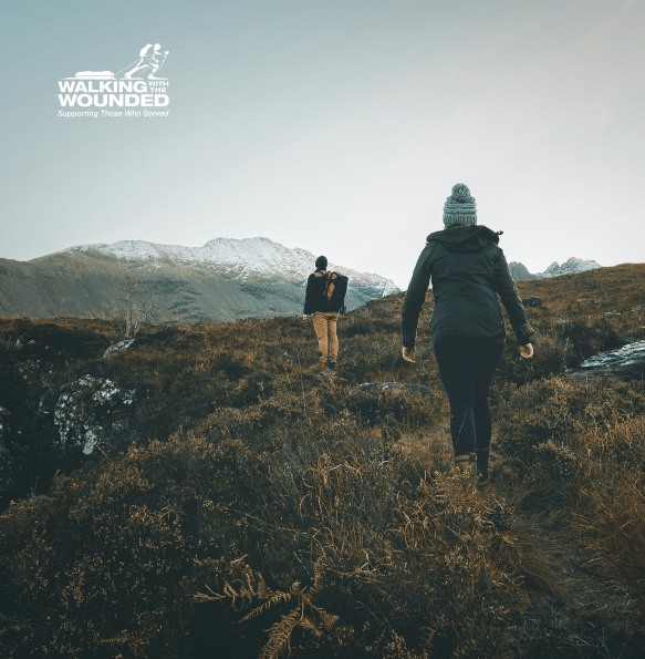 Two people hiking across mountain landscape | Walking With The Wounded