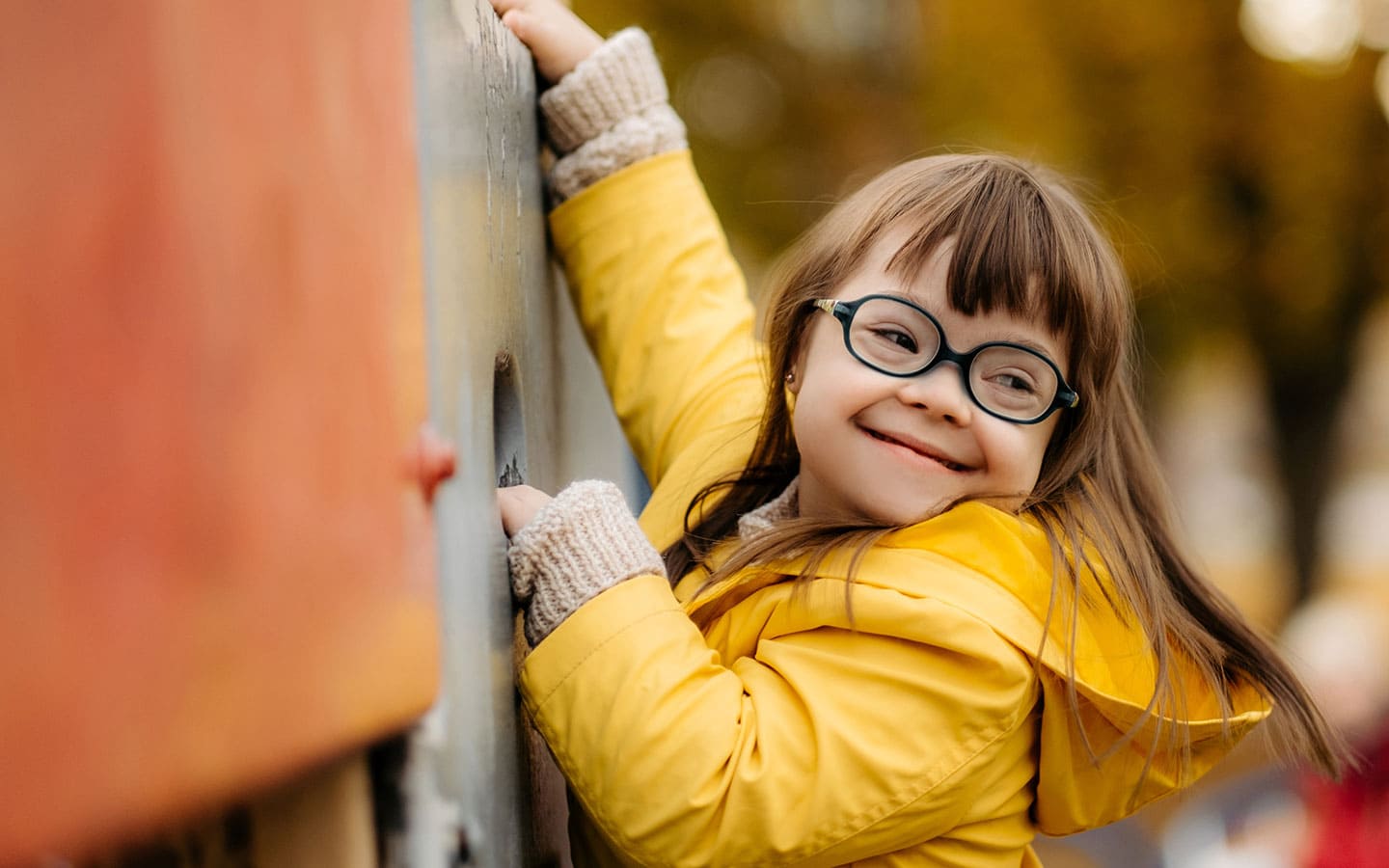 Girl with glasses, smiling
